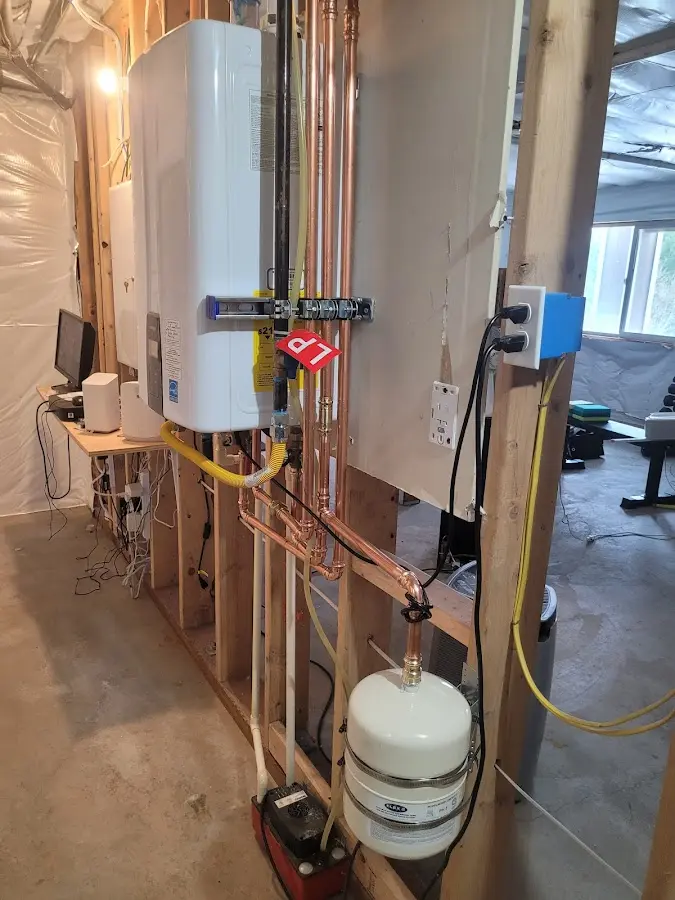 Licensed plumber repairing a kitchen sink in Greene